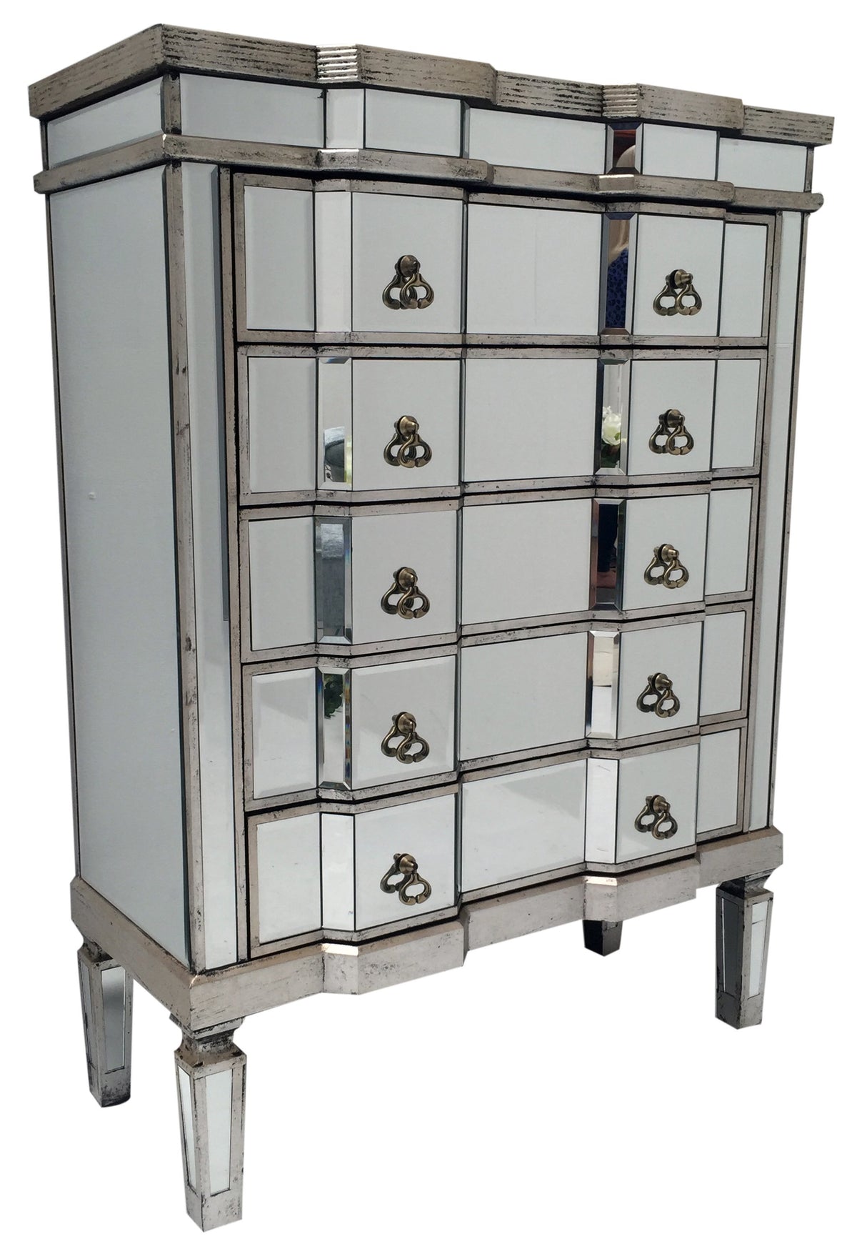 Mirrored chest of five drawers in antiqued silver finish edges, view from left front angle