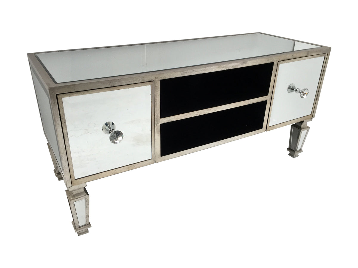 Mirrored TV unit with two drawers on each side and two shelves between them. Features bevelled mirrored panels, diamante handles and antiqued silver finish