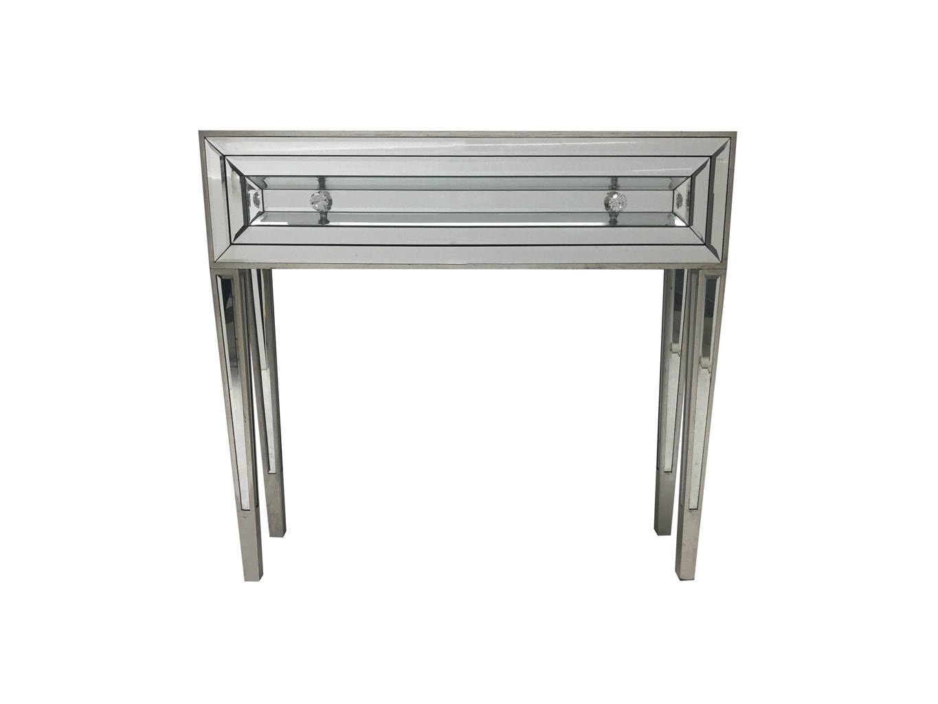 Mirrored console table with one drawer and two diamante handles, front view.
